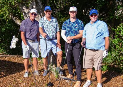 Flamingoes appear on each golfers apparel earning them an extra mulligan. Left to Right: Rob Bruce, Peter Wright, Brawley Adams and Mike Wasson.